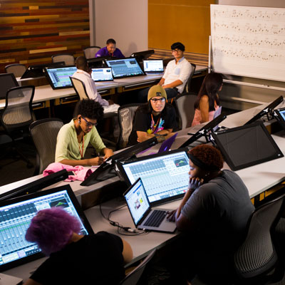 Students having a discussion in the studio